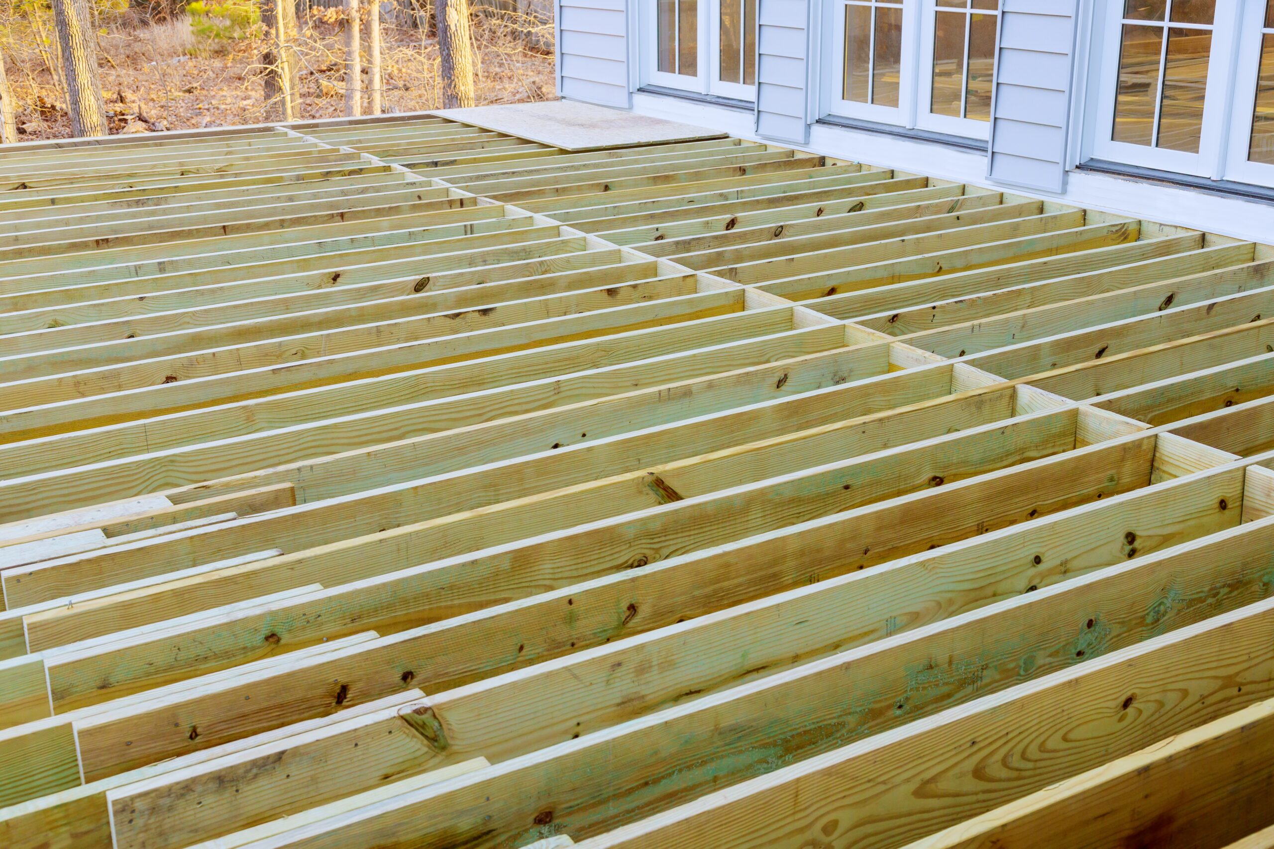 Fragment planks installing wood floor for patio deck with new wooden decking